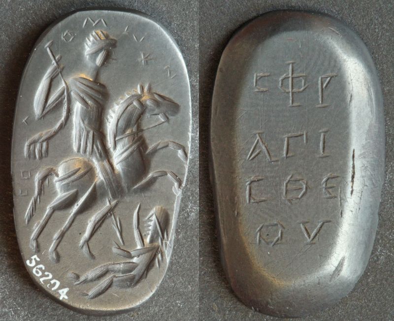The front and back view of a dark grey, slightly glossy stone. The front is inscribed with the image of a man on a horse spearing a woman, with some Greek text above it. The back is inscribed with Greek text written in three lines.